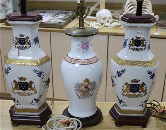 Two Chinese armorial style lamps on stands and one other lamp